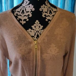 Gold flat top with a very large gold zipper